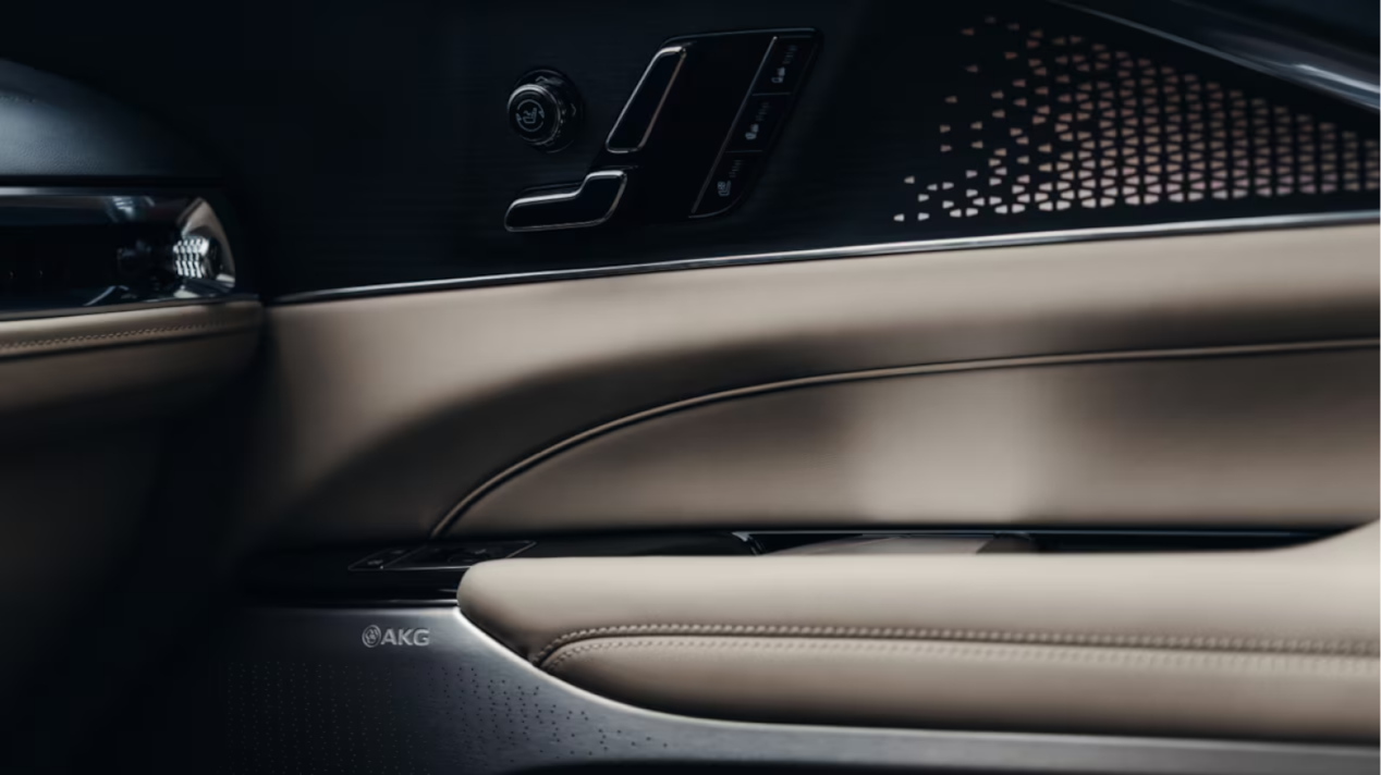 OPTIQ’s luxuriously padded door from the inside. It shows one of 19 built-in AKG speakers that make the cabin a concert hall.