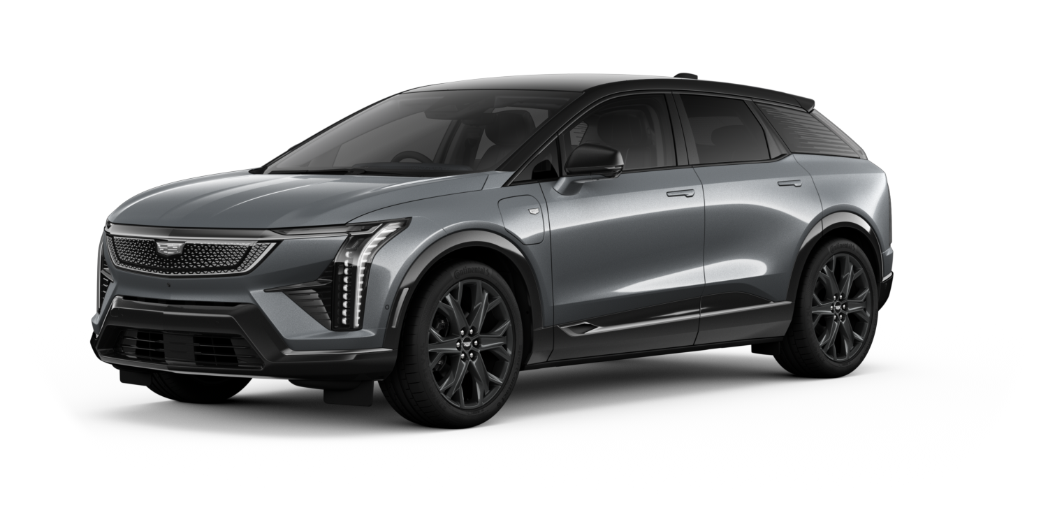 Studio image of a Cadillac OPTIQ electric SUV shown in three quarter front view against a dark background.