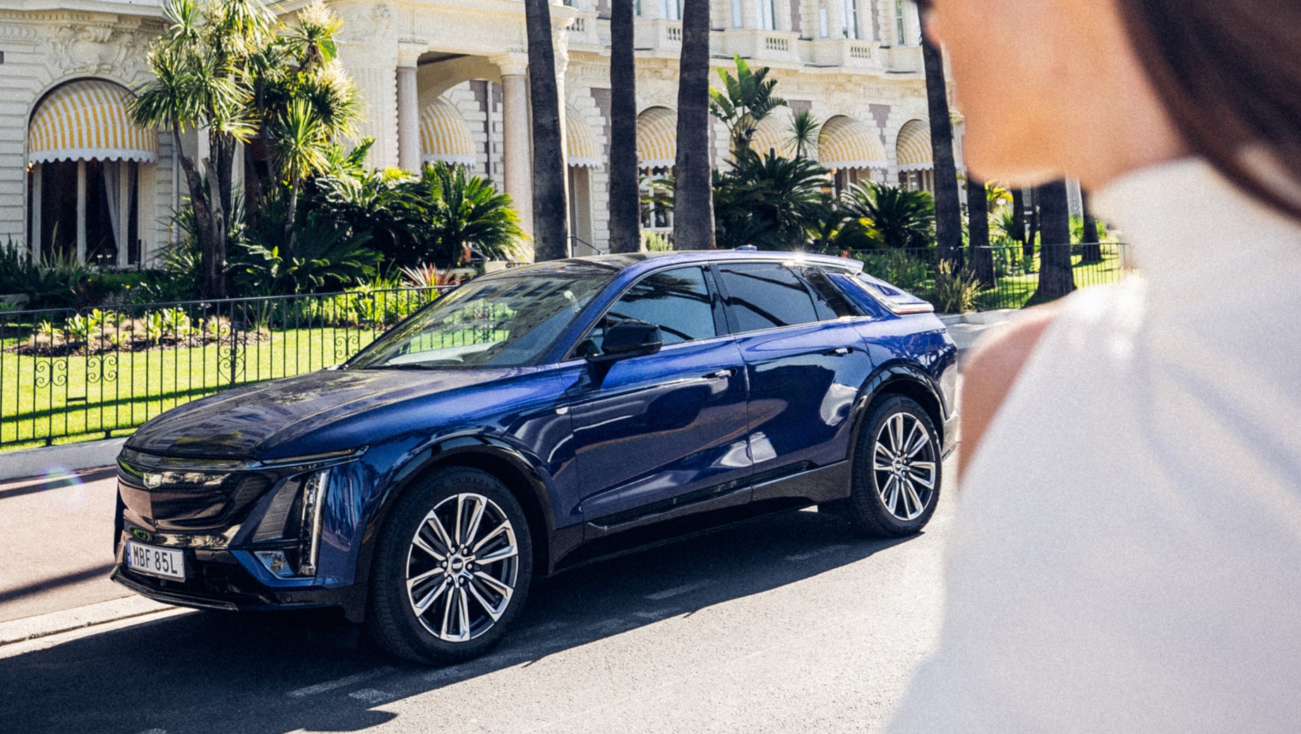 Person in front of a Cadillac LYRIQ