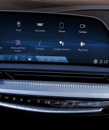 Close up view of the Cadillac LYRIQ interior showing the digital display with music playback information.