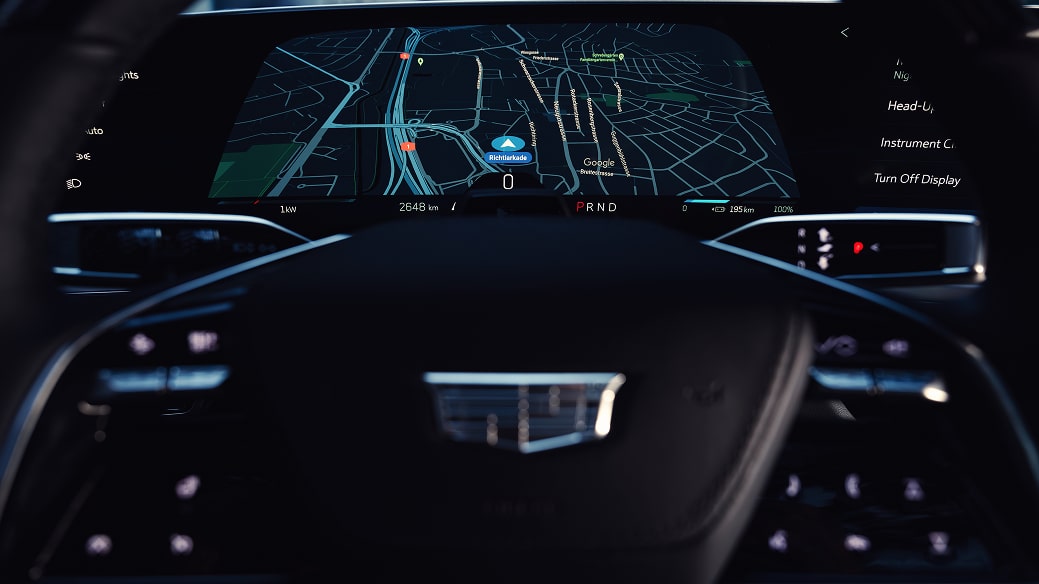 Close up view of the Cadillac LYRIQ steering wheel with a digital navigation map displayed on the instrument screen.